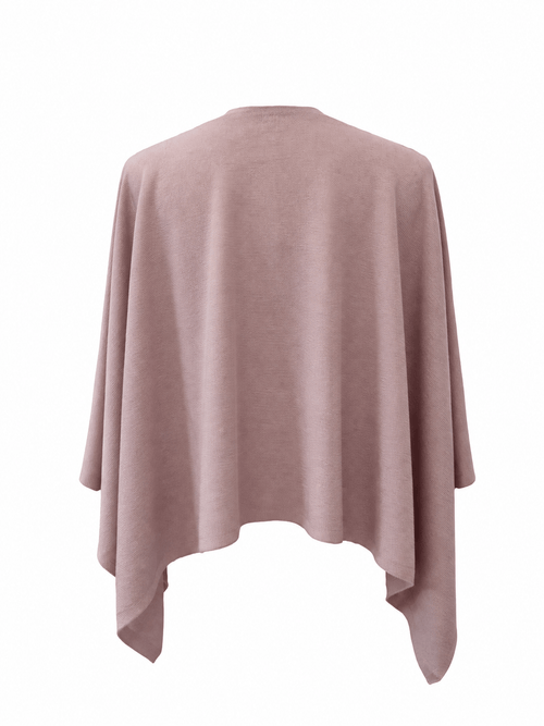 A dusty rose pink knit poncho sweater shown from the back, featuring a relaxed draped fit and an asymmetrical hem, displayed on a clean white background.